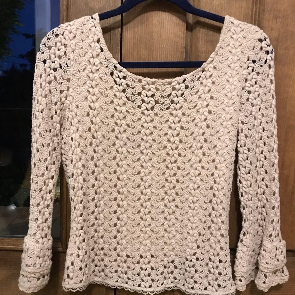 Free People tan long crocheted with bell sleeves.